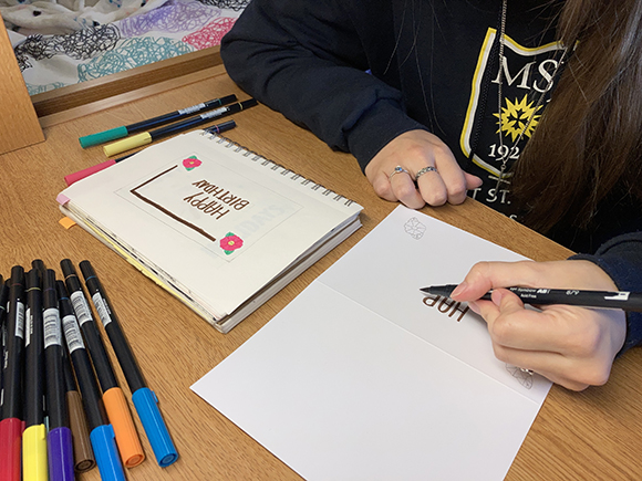 Woman draws with a marker