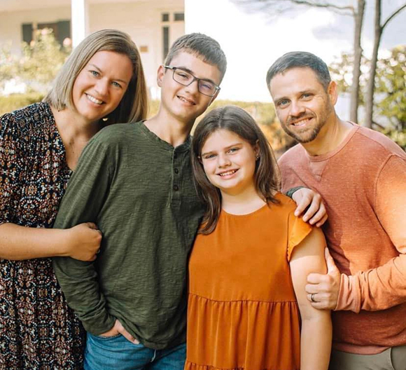 jason umberg and family smiling