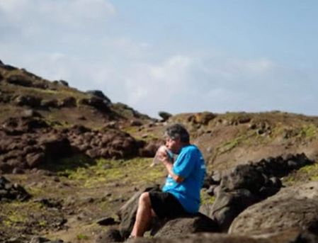 Man sits on rocks