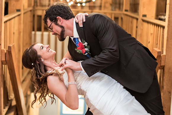 bride and groom smiling and dancing