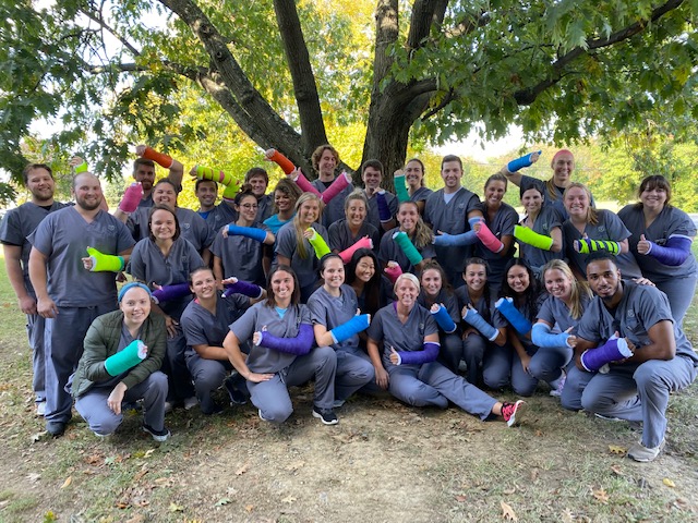 physician assistant class group outside smiling