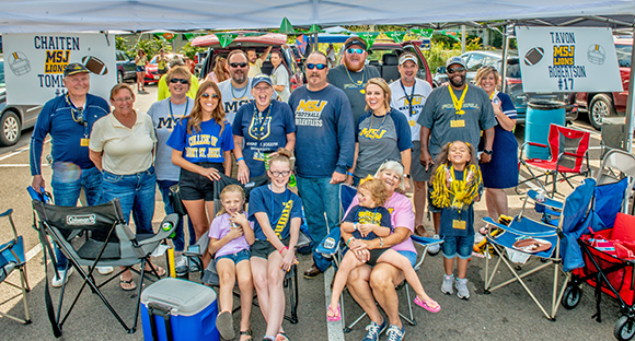 msj alumni gathered at tailgate for coming