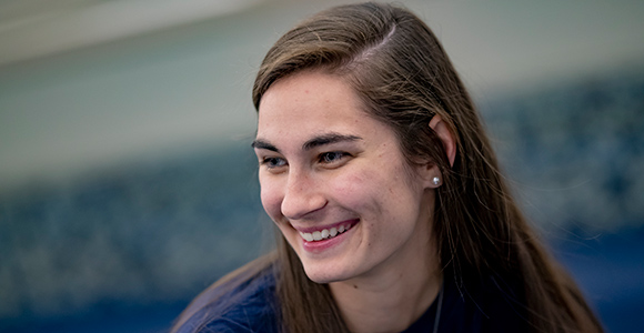 Mount St. Joseph University gen z student smiling in MSJ dining hall.