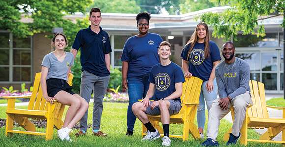 Mount St. Joseph University Students in quad smiling.