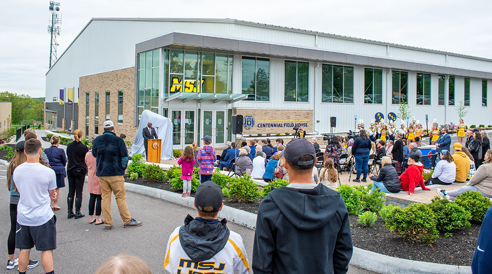 MSJ audience gathered in front of Centennial Field House for Lion Sculpture Unveiling Ceremony.